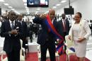 Haitian President, Michel Martelly (C) take his presidential sash off during a ceremony in the Haitian Parliament on February 7, 2016 in Port-au-Prince