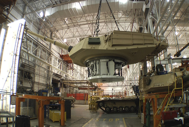 FILE - This undated file photo provided by the General Dynamics Land System shows the production of an Abrams tank in Lima, Ohio. Lawmakers from both parties have devoted nearly half a billion dollars in taxpayer money over the past two years to build improved versions of the 70-ton Abrams, which the Army refers to with a moniker that befits their heft: the M1A2SEPv2. The upgraded tanks cost about $7.5 million each, according to the Army, and service officials say they have plenty of them. (AP Photo/General Dynamics Land System, File)