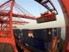 A crane loads containers at a port in Lianyungang, Jiangsu province