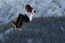 Canada's Sebastien Toutant performs a jump during the men's slopestyle snowboarding qualifying session at the 2014 Sochi Olympic Games in Rosa Khutor