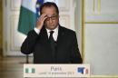 French President Francois Hollande gives a press conference with his Nigerian counterpart at the Elysee palace in Paris on September 14, 2015