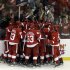 Detroit Red Wings players celebrate Henrik Zetterberg's goal in overtime against the Anaheim Ducks in Game 6 of a first-round NHL hockey Stanley Cup playoff series in Detroit, Friday, May 10, 2013. Detroit won 4-3. (AP Photo/Paul Sancya)