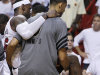 Miami Heat small forward LeBron James (6) is carried from the floor after taking a spill against the Oklahoma City Thunder during the second half at Game 4 of the NBA Finals basketball series, Tuesday, June 19, 2012, in Miami.  (AP Photo/Lynne Sladky)