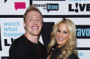FILE - In this Jan. 29, 2012 file image released by Bravo, Kroy Biermann, left, and Kim Zolciak pose backstage after Bravo's 
