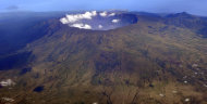 In this Oct. 19, 2010 aerial photo, Mount Tambora's 10 kilometers (more than 7 miles) wide and 1 kilometer (half a mile) deep volcanic crater, created by the April 1815 eruption, is shown. Bold farmers routinely ignore orders to evacuate the slopes of live volcanos in Indonesia, but those on Tambora took no chances when history's deadliest mountain rumbled ominously this month, Sept., 2011. (AP Photo/KOMPAS Images, Iwan Setiyawan) EDITORIAL USE ONLY