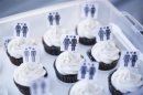 A box of cupcakes are seen topped with icons of same-sex couples at City Hall in San Francisco