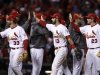 St. Louis Cardinals' Descalso, Carpenter and Freese celebrate after defeating the San Francisco Giants in Game 4 of their MLB NLCS playoff baseball series in St. Louis