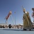 Pope Benedict XVI walks on the altar to celebrate a Holy Mass in Ancona's shipyard, on the shores of the Adriatic Sea,  Sunday, Sept. 11, 2011. The pontiff commemorated the Sept. 11 attacks in the United States, urging the international community to be always against violence. (AP Photo/Pier Paolo Cito)