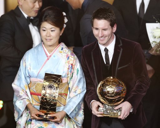 Argentina's Lionel Messi and Japan's Homare Sawa stand together after being awarded the prize for the soccer players of the year 2011 at the FIFA Ballon d'Or awarding ceremony in Zurich, Switzerland, Monday, Jan. 9, 2012. (AP Photo/Michael Probst)