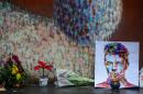 Floral tributes beneath a mural of David Bowie in Brixton, south London, on January 11, 2016