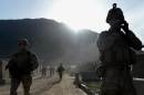 US army soldiers march from the Forward Base Honaker Miracle at Watahpur District in Kunar province during a joint patrol led by the Afghan National Army (ANA) on April 18, 2013