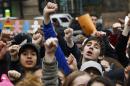 Students from high schools and colleges throughout New York city protest with clenched fists, during a rally against President Donald Trump's executive order banning travel from seven Muslim-majority nations, Tuesday Feb. 7, 2017, in New York's Foley Square. (AP Photo/Bebeto Matthews)
