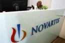 A man speaks on a telephone inside Novartis India headquarters in Mumbai