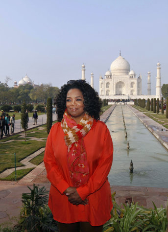 U.S. talk show host Oprah Winfrey poses at the Taj Mahal in Agra, India, Thursday, Jan. 19, 2012. (AP Photo/Mustafa Quraishi)