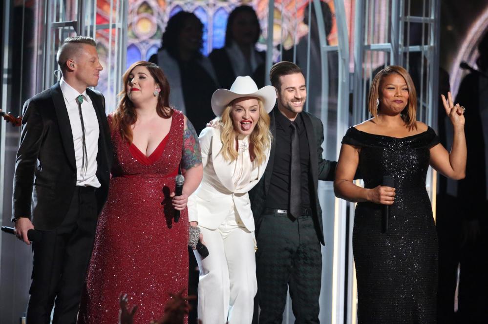 Performers, from left, Macklemore, Mary Lambert, Madonna, Ryan Lewis and Queen Latifah appear on stage during a performance of "Same Love" at the 56th annual Grammy Awards at Staples Center on Sunday, Jan. 26, 2014, in Los Angeles. (Photo by Matt Sayles/Invision/AP)
