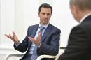 Syrian President Assad speaks during a meeting with Russian President Putin at the Kremlin in Moscow