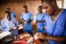 Healthcare workers prepare medicines for Patients at an Ebola treatment centre in Hastings, Freetown, Sierra Leone, Wednesday, Oct. 15, 2014. Some doctors in countries hit hardest by the deadly Ebola disease decline to operate on pregnant women for fear the virus could spread. Governments face calls from frightened citizens to bar travel to and from the afflicted region. Meanwhile, the stakes get higher as more people get sick, highlighting a tricky balance between protecting people and preserving their rights in a global crisis. (AP Photo/Michael Duff)