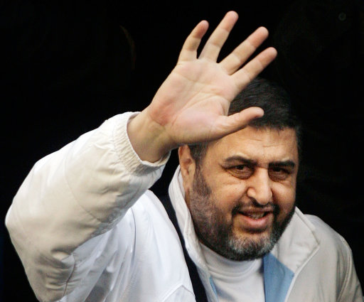 FILE- In this Monday, Dec. 10, 2007 file photo, Egyptian Muslim Brotherhood's top financial figure Khayrat el-Shater gestures as he leaves a prison vehicle to enter one of his civilian investigations in Cairo, Egypt. Egypt's Muslim Brotherhood on Saturday said it decided to field the movement's deputy leader and top strategist as its presidential candidate, topping off its success in legislative elections with a bid for the country's most powerful post. Top leaders of the country's most influential political group announced in a press conference that it selected Khayrat el-Shater to contest the presidential race set to start in May.(AP Photo/Amr Nabil, File)