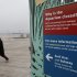 A woman walks past an entrance to the Wildlife Conservation Society's New York Aquarium in Coney Island, New York, Monday, March 25, 2013.  (AP Photo/Seth Wenig)