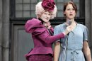 In this image released by Lionsgate, Elizabeth Banks portrays Effie Trinket, left, and Jennifer Lawrence portrays Katniss Everdeen in a scene from 