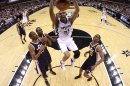 Tim Duncan of the San Antonio Spurs gets a slam dunk against the Utah Jazz in Game One