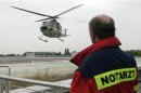 Emergency doctor Benecker watches as intensive care transport helicopter ITH 