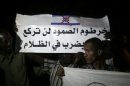 Protesters hold banners and chant anti-Israel slogans in Khartoum