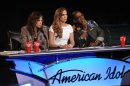 FILE - In this file image released by Fox, judges from left, Steven Tyler, Jennifer Lopez and Randy Jackson listen to contestants on the singing competition series 