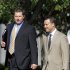 Former Major League Baseball pitcher Roger Clemens, left, arrives at federal court in Washington, Friday, June 8, 2012, for his perjury trial. (AP Photo/Haraz N. Ghanbari)