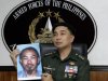 Armed Forces of the Philippines spokesman Col. Marcelo Burgos shows a picture of Malaysian Zulkipli bin Hir, also known as Marwan, a top leader of the regional, al Qaida-linked Jemaah Islamiyah terror network, during a press conference Thursday, Feb. 2, 2012 in suburban Quezon City, north of Manila, Philippines. The military said it killed Southeast Asia's most-wanted terrorist and two other senior militants Thursday in a U.S.-backed airstrike that would mark one of the region's biggest anti-terror successes in recent years. The dead included Zulkipli bin Hir, leader of the Philippines-based Abu Sayyaf militants, Umbra Jumdail, and a Singaporean leader in Jemaah Islamiyah, Abdullah Ali. (AP Photo/Pat Roque)