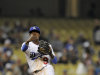 Los Angeles Dodgers shortstop Dee Gordon throws out Pittsburgh Pirates' Andrew McCutchen at first during the seventh inning of a baseball game, Thursday, Sept. 15, 2011, in Los Angeles.  (AP Photo/Mark J. Terrill)