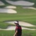 Poulter of England looks back on the 15th fairway during the final day of the WGC-HSBC Champions Tournament at Mission Hills in Dongguan