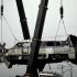 FILE - In this July 24, 2011 file photo, a wrecked passenger carriage is lifted off the bridge in Wenzhou in east China's Zhejiang province, after a train crash. A long-awaited government report said on Wednesday Dec. 28, 2011, design flaws and sloppy management caused the bullet train crash in July that killed 40 people and triggered a public outcry over the dangers of China's showcase transportation system. (AP Photo, File) CHINA OUT