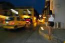 A prostitute poses at the Historical street in Cartagena on April 19, 2012