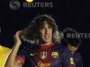Barcelona's captain Puyol gestures during the presentation ceremony of his team in Barcelona