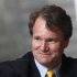 Bank of America Chief Executive Brian Moynihan smiles during an interview in Hong Kong