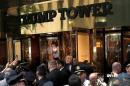 Republican presidential nominee Donald Trump waves to supporters outside the front door of Trump Tower where he lives in the Manhattan borough of New York