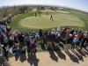 A crowd watches as Tiger Woods practices on the eighth green for the Match Play Championship golf tournament, Tuesday, Feb. 19, 2013, in Marana, Ariz. (AP Photo/Julie Jacobson)