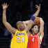 Los Angeles Lakers guard Kobe Bryant (24) and Houston Rockets forward Luis Scola (4), of Argentina, battle for possession in the first half of an NBA basketball game, Friday, April 6, 2012, in Los Angeles. (AP Photo/Gus Ruelas)