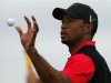 Tiger Woods of the U.S. catches his ball on the 15th green during the final round of the British Open golf championship at Royal Lytham & St Annes