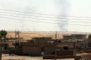 Smoke billows after an air strike near the Mosul dam on August 17, 2014