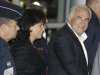 Dominique Strauss-Kahn, former head of the International Monetary Fund, and his wife Anne Sinclair, smile upon their arrival at Roissy airport, north of Paris, France, Sunday, Sept. 4, 2011. Strauss-Kahn returned home to France for the first time since a New York hotel maid accused him of attempted rape, unleashing a scandal that dashed his chances for the French presidency.(AP Photo/Michel Euler)