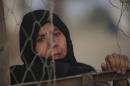An Iraqi Sunni displaced woman, who fled the violence in the city of Ramadi, is seen at the outskirts of Baghdad
