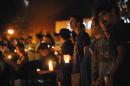 Students hold candles during a vigil honoring U.S. journalist Steven Sotloff at the Reflection Pool on the campus of the University of Central Florida in Orlando