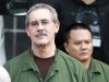 R. Allen Stanford, center, leaves the Bob Casey Federal Courthouse, Tuesday, March 6, 2012, in Houston. Stanford, once considered one of the wealthiest people in the U.S., with a financial empire that spanned the Americas, was convicted Tuesday on charges he bilked investors out of more than $7 billion. (AP Photo/Houston Chronicle, Nick de la Torre)