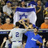 Israel's Josh Satin (2) is congratulated after scoring on a double by Charlie Cutler against South Africa in the eighth inning of a World Baseball Classic qualifier baseball game in Jupiter, Fla., Wednesday, Sept. 19, 2012. Shawn green and Jack Marder also scored on the double. Israel won 7-3. (AP Photo/Alan Diaz)