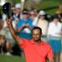 Tiger Woods waves his hat to the crowd after winning the Arnold Palmer Invitational golf tournament at Bay Hill in Orlando, Fla., Sunday, March 25, 2012. (AP Photo/Phelan M. Ebenhack)