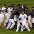 Detroit Tigers' Phil Coke and teammates celebrate after winning Game 4 of the American League championship series against the New York Yankees Thursday, Oct. 18, 2012, in Detroit. The move on to the World Series. (AP Photo/Darron Cummings)