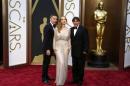 Ethan Hawke, Julie Delpy and Richard Linklater, best adapted screenplay nominees for their film "Before Midnight" pose at the 86th Academy Awards in Hollywood