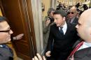 Democratic Party head Matteo Renzi arrives to his party headquarters for a meeting with former Italian Premier Silvio Berlusconi, in Rome, Saturday, Jan. 18, 2014. Renzi, who leads the main party in Italy's fragile coalition government, is courting the media mogul in hopes of broadening support for electoral reforms to make Italy more governable. Berlusconi's tax fraud conviction keeps him from holding public office now, but he hopes for a political comeback as head of his right-leaning Forza Italia party. (AP Photo/Daniele Leone, Lapresse)